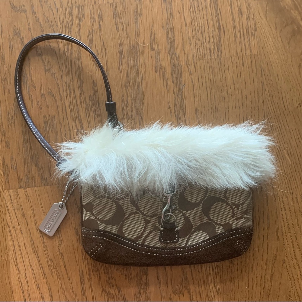 Coach Signature C wristlet with fur